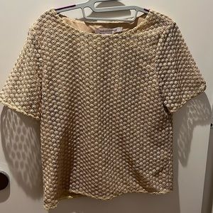 Short sleeve Diane Von Furstenberg blouse. Gold with a bit of shimmer
